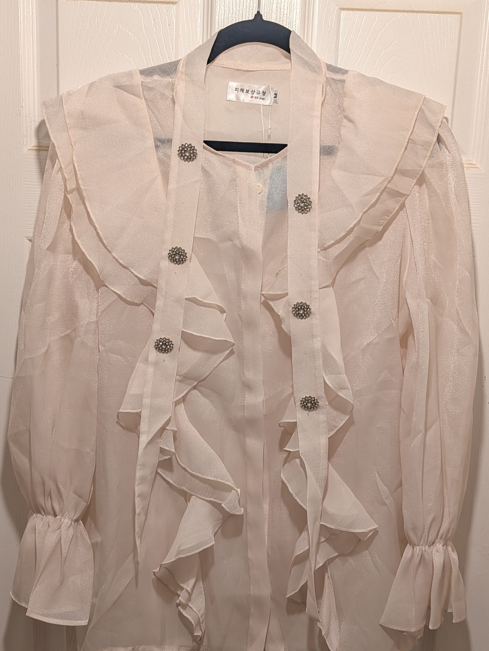 Tie-Neck Ruffle Sheer Blouse in Cream